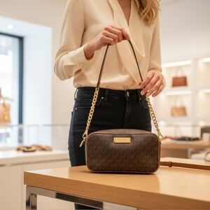 Michael Kors Jet set crossbody bag featuring the signature logo print